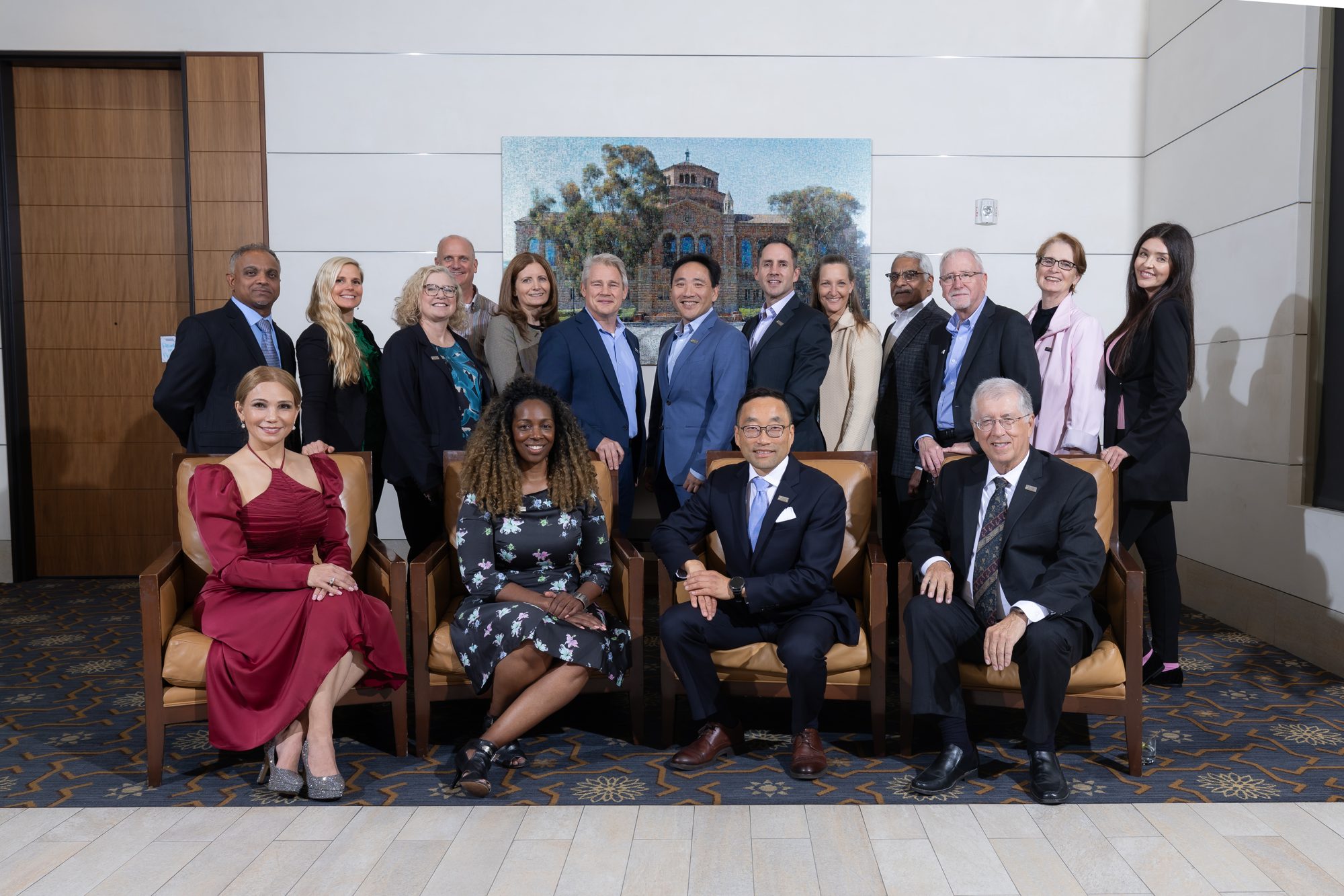 A group of honourees and organisers posed together at a corporate event