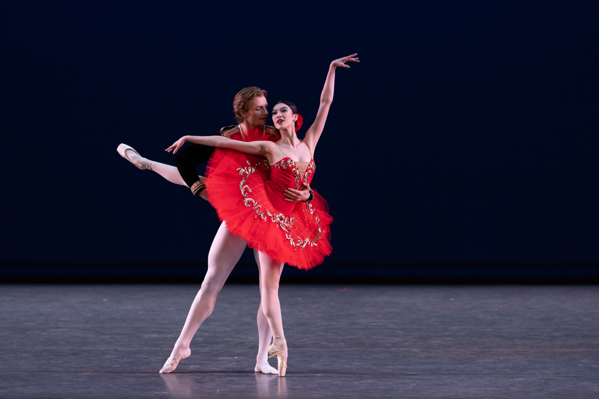 Pas de deux with a ballerina in a red tutu